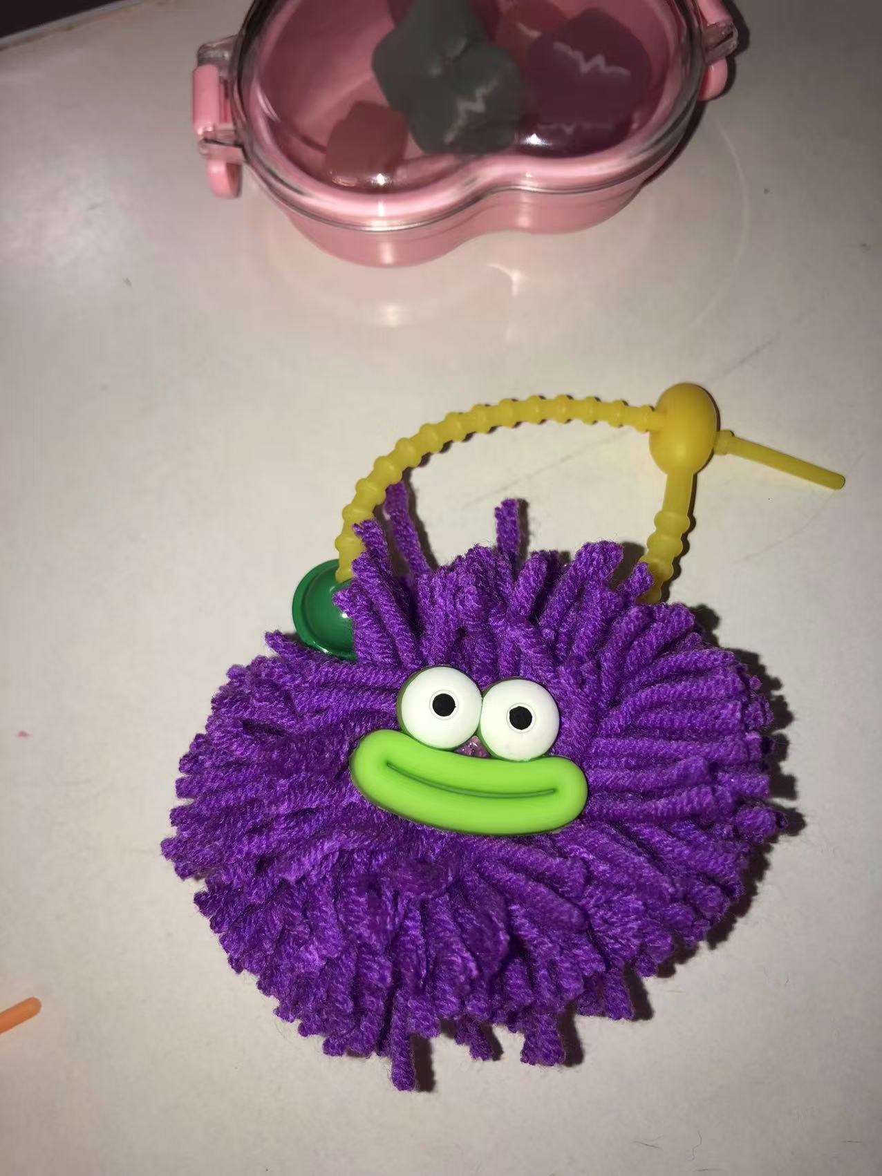 Closeup of finished pompom charm